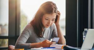 Image of an Asian woman using a cell phone