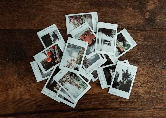 a photo of a pile of labelled polaroids