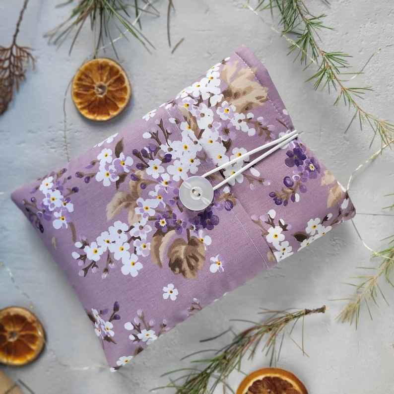 photo of a book sleeve in purple with beautiful white flowers
