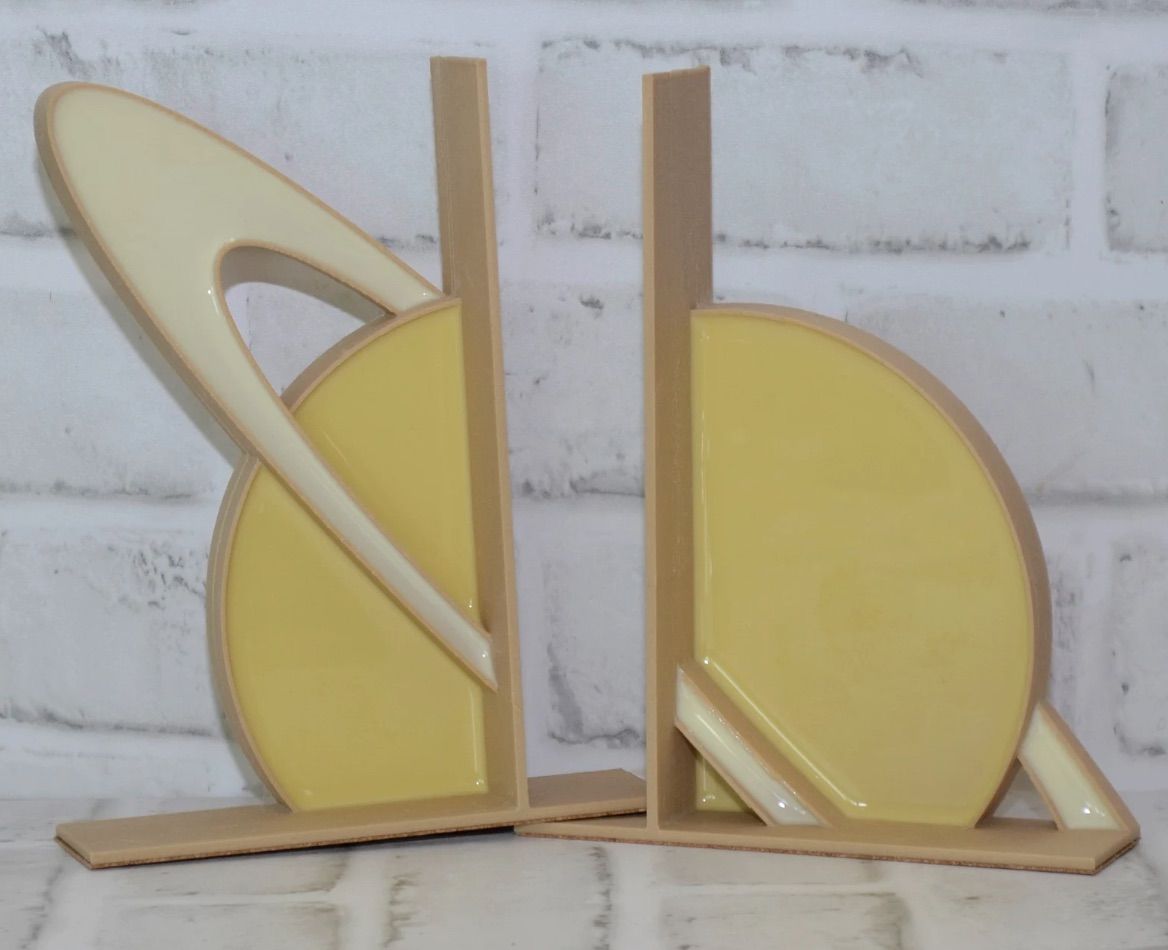 Set of bookends in the shape of Saturn.