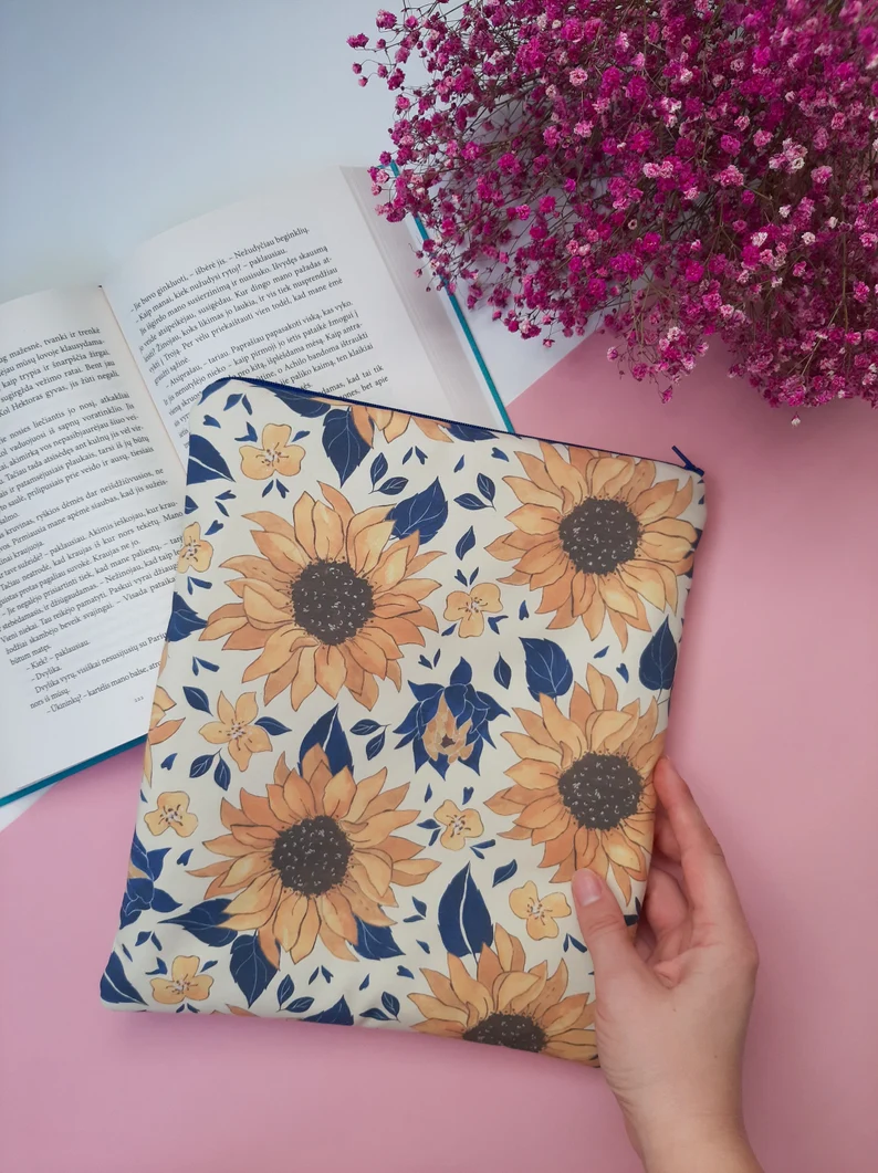 Photo of a book sleeve with sunflowers and dark blue leaves