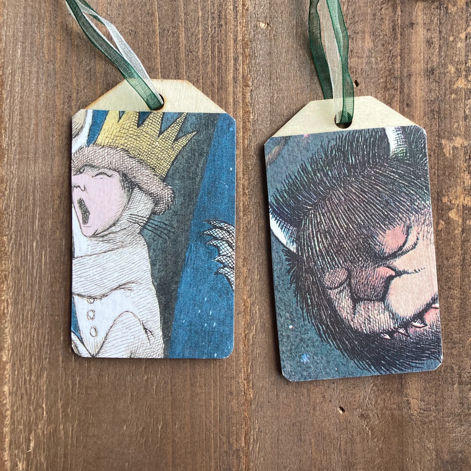flat wooden ornament decorated with pages from Where the Wild Things Are