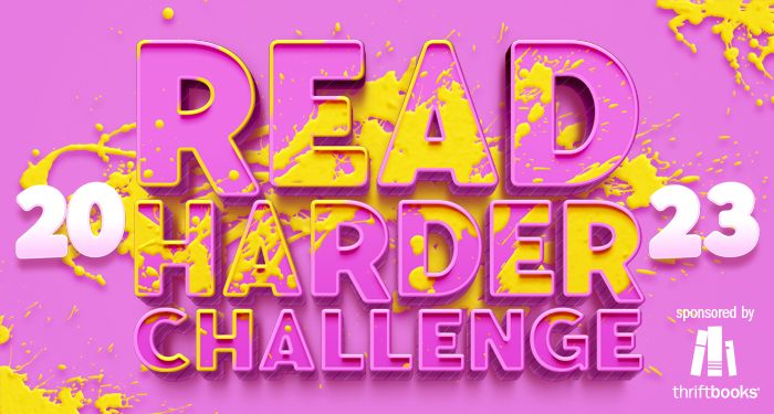 announcement for Book Riot's 2023 Read Harder Challenge, showing pink outlined text against a pink background with splashes of yellow paint