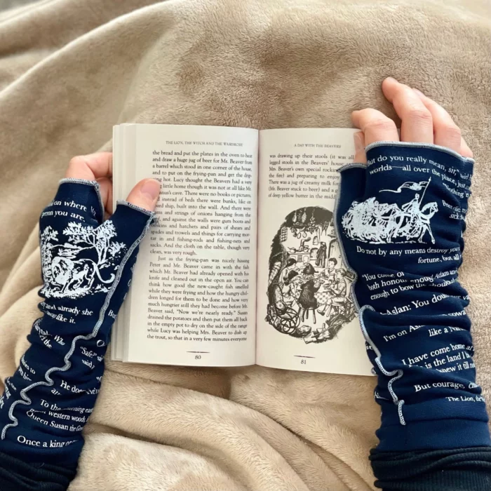 Hands in gloves holding a book