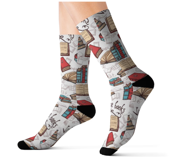 White socks with black toes and heels and a vintage-inspired pattern of books. 