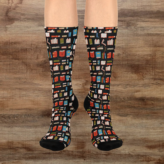 Tall black socks with a pattern of red, blue, and green books