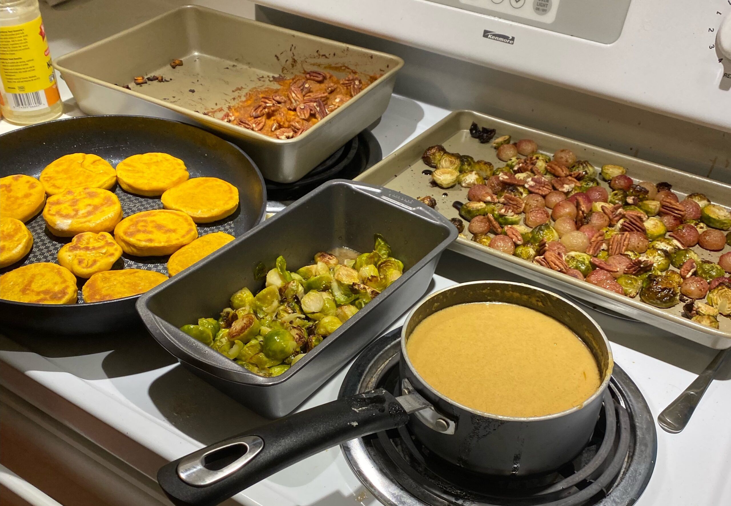 Sopaipillas, Brussels, Sweet Potato Casserole, and my must-have: Yeast Gravy arranged on the stovetop