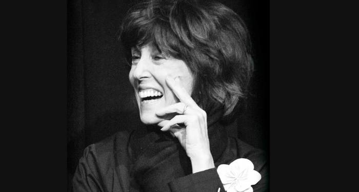 a cropped cover of She Made Me Laugh, featuring a black and white photo of Nora Ephron laughing