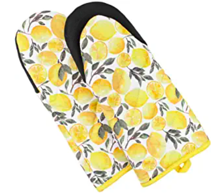 Two oven mitts with an illustrated lemon printed fabric and neoprene grips