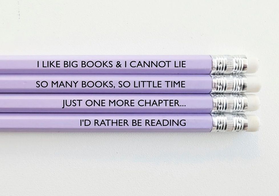 Set of four lavender colored pencils, each of which has a bookish saying. 