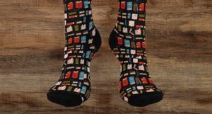 Tall black socks with a pattern of red, blue, and green books