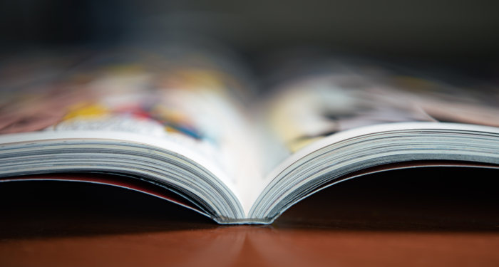 a photo of a graphic novel open on a table