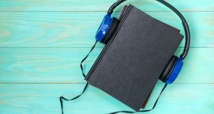 Image of a black book with blue headphones