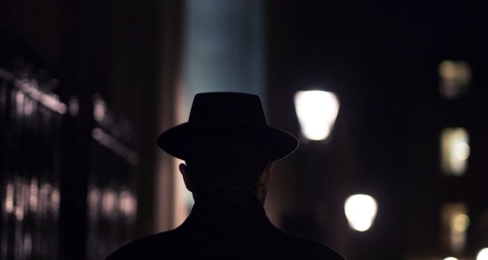 man in hat, city lights