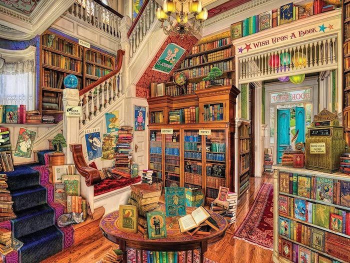 puzzle of a reading room packed wall to wall and floor to ceiling with books, plus a winding staircase on the left | best gifts for readers 2022