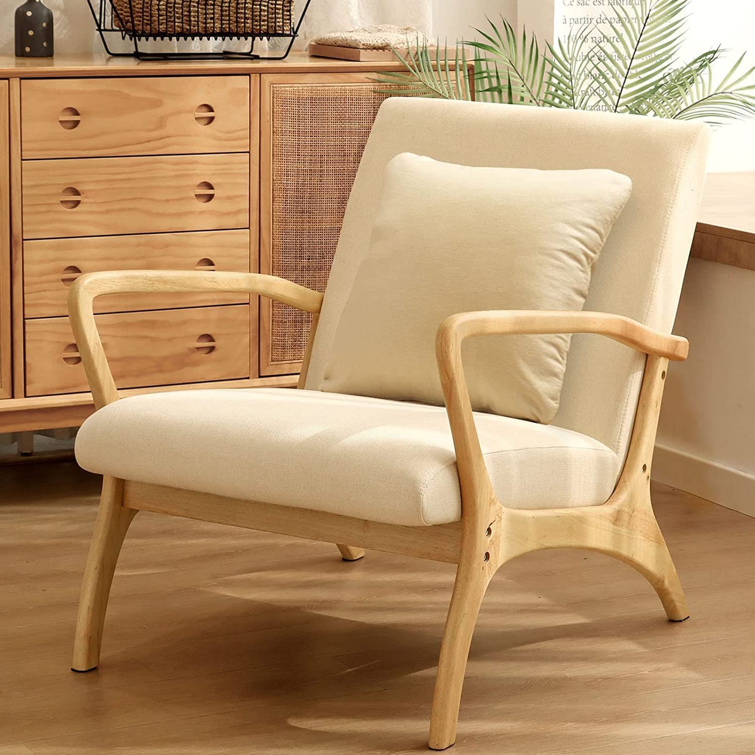 beige cushioned chair with wooden handles and legs