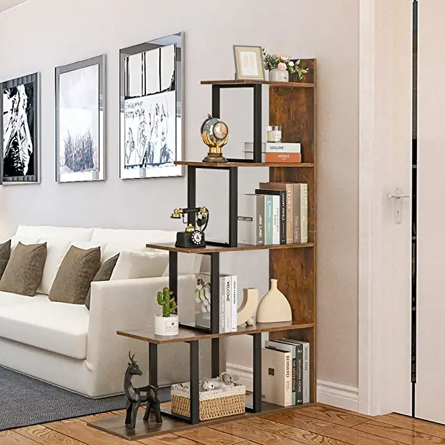 Brown bookshelf used as a room divider in a small apartment