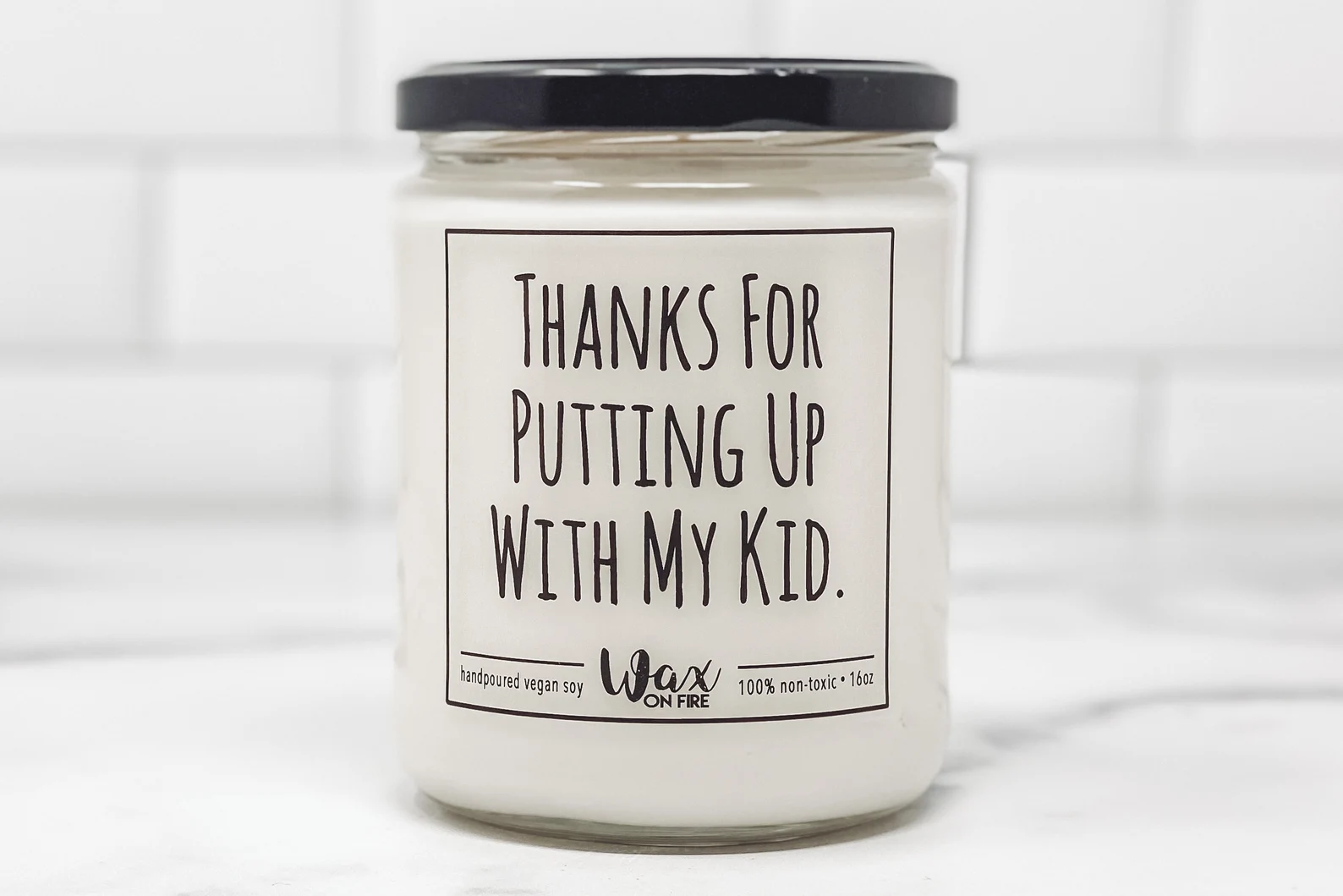 picture of "Thanks for putting up with my kid" candle gift