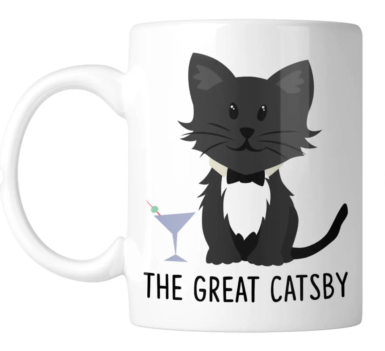 Image of a white mug. It features a tuxedo cat and a martini glass. Beneath the image it reads "the great catsby."
