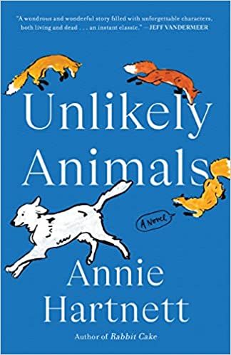paperback cover of Unlikely Animals by Annie Hartnett; blue with cartoon foxes chasing a white dog