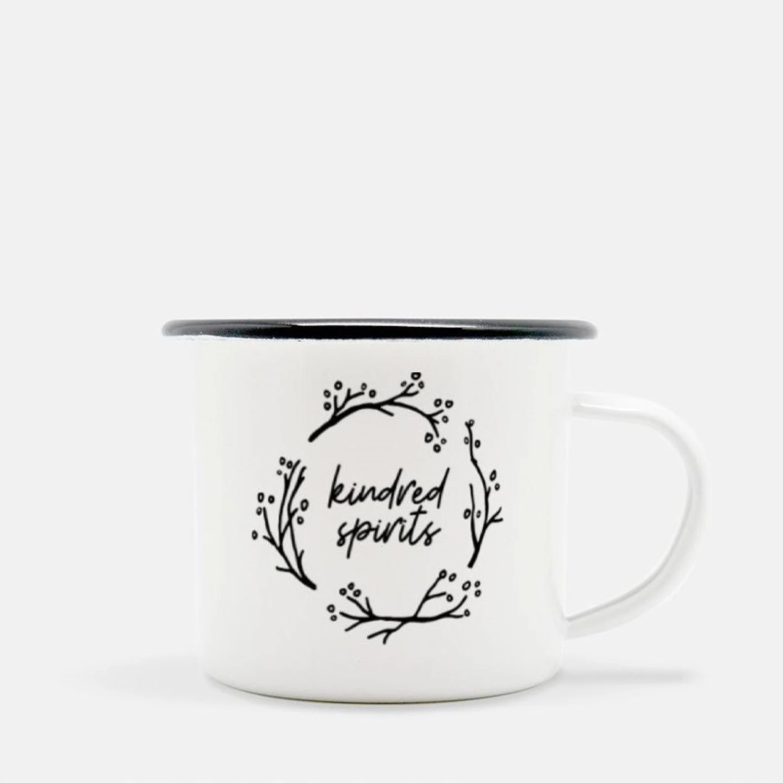 whit and black camp mug that reads "kindred spirits" circles in a black line illustration of branches and berries