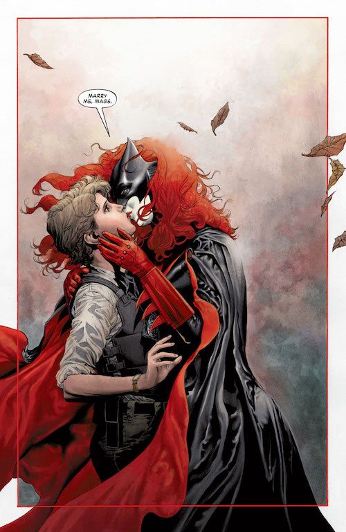 A splash page from Batwoman #17. Batwoman, in full costume, kisses a startled Maggie, in uniform and bulletproof vest.
Batwoman: Marry me, Mags.