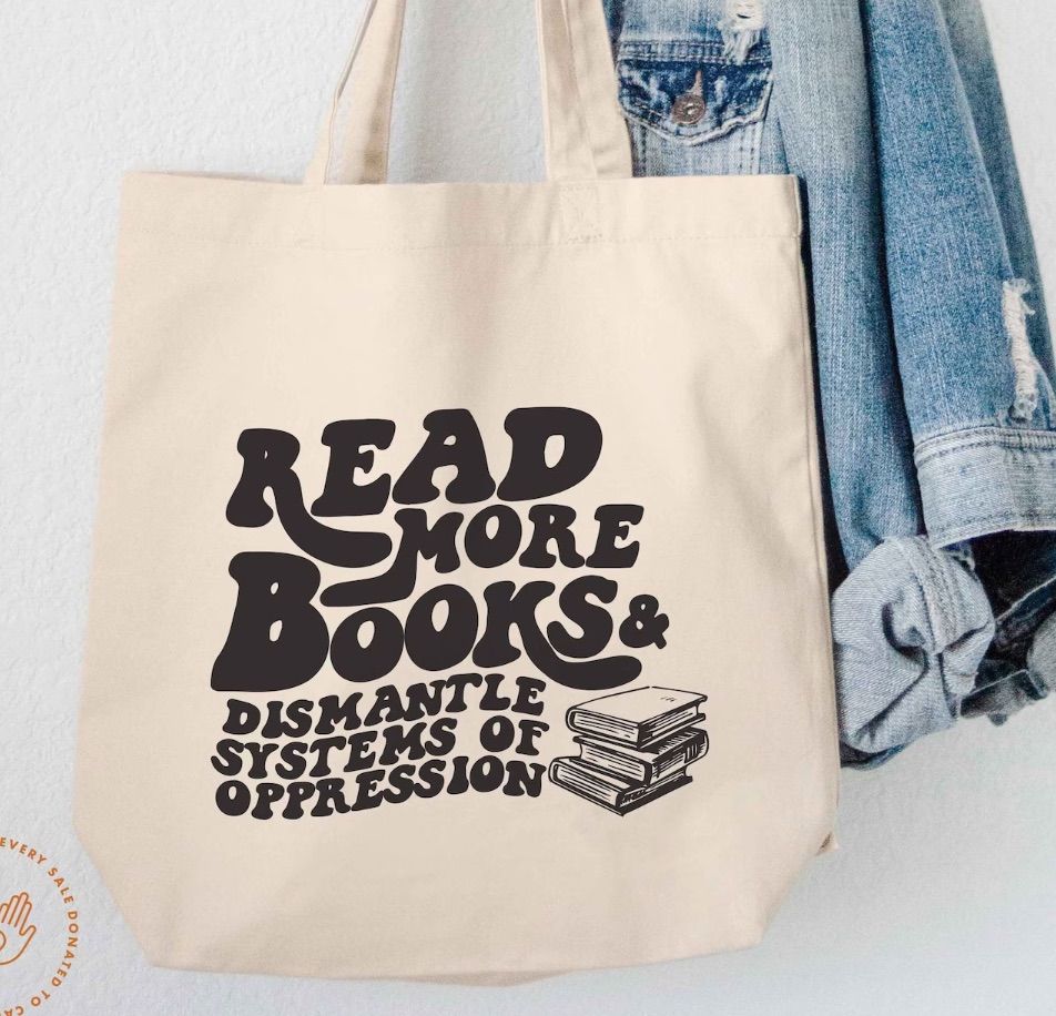 Image of a canvas tote bag with black text that says 