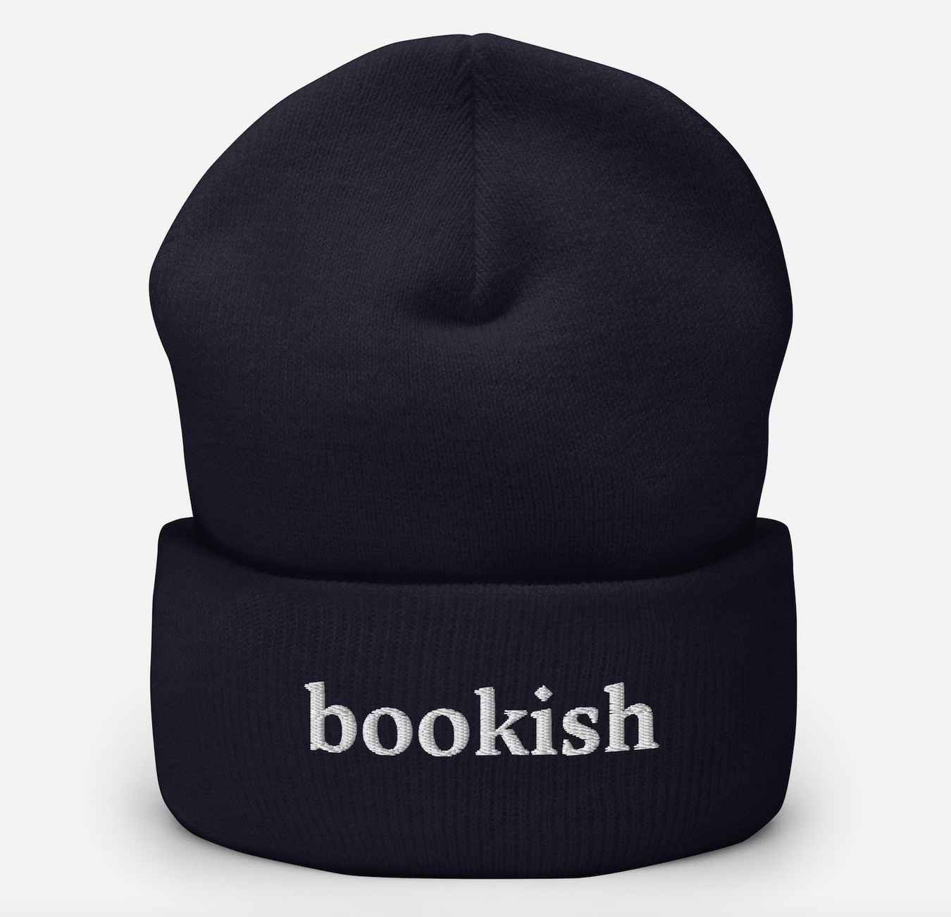 Navy beanie with white embroidered text that says "bookish"