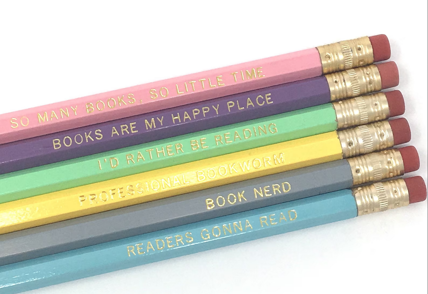 A set of pencils with engraved bookish sayings like "so many books, so little time" and "books are my happy place"