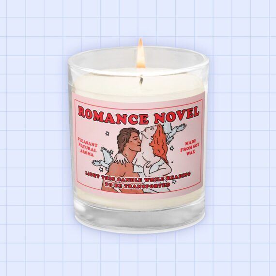 image of a candle with a cartoon image of a couple swooning as if on a romance novel cover 