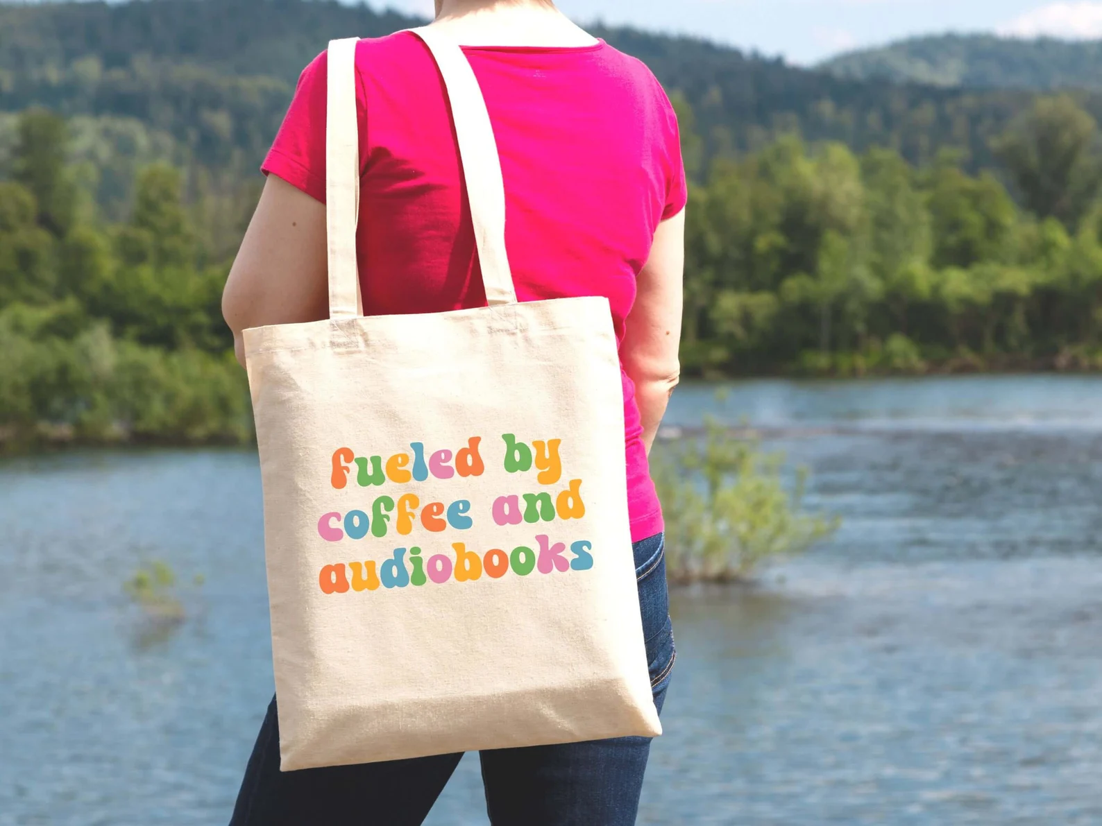 picture of "fueled by coffee and audiobooks" tote bag in retro letters
