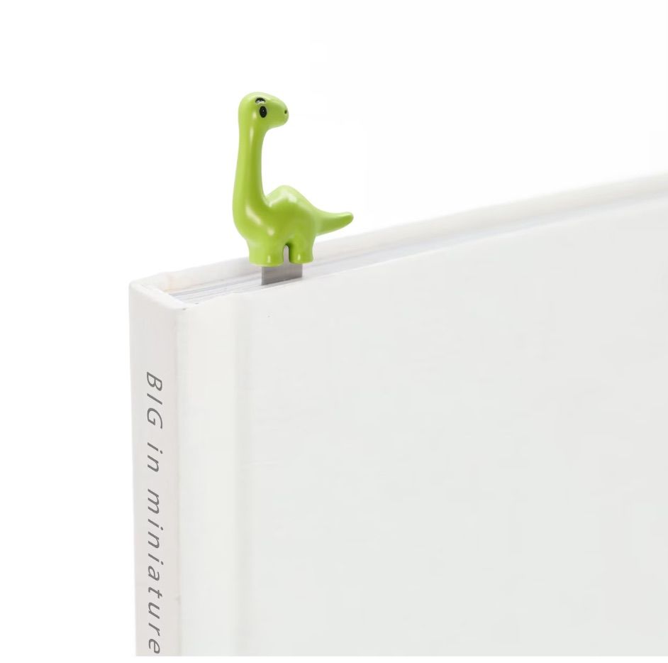 Image of a 3-D bookmark in the shape of a green dinosaur. 