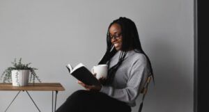 Image of a Black woman reading