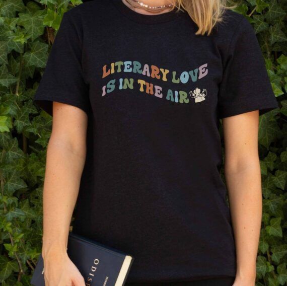 black tshirt with rainbow colored letters reading Literary Love Is In the Air 