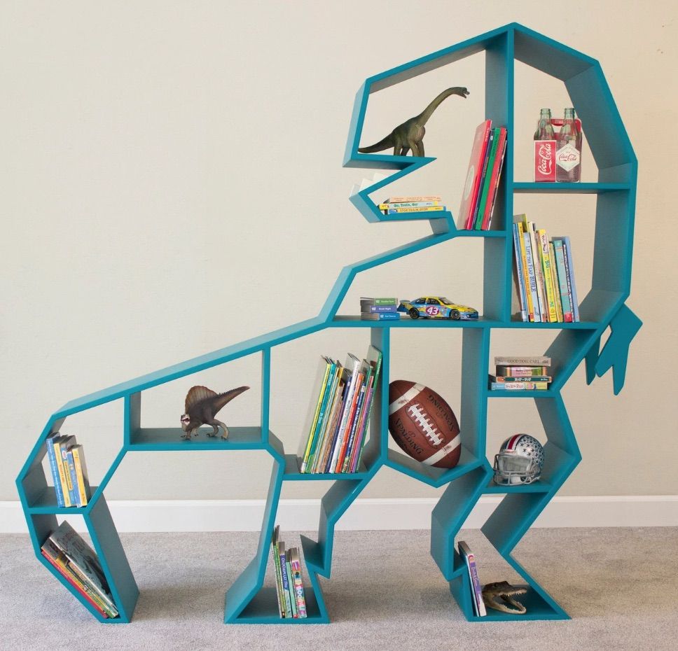 Image of a green bookshelf in the shape of a t-rex.