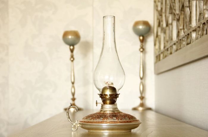 a photo of an antique oil lamp