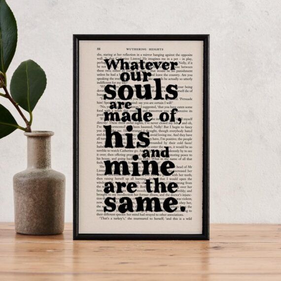 a print with book page background and large bubble letters spelling out a wuthering heights quote