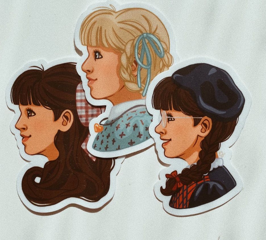 Image of 3 vinyl stickers, one with Samantha, one with Kirsten, and one with Molly. 