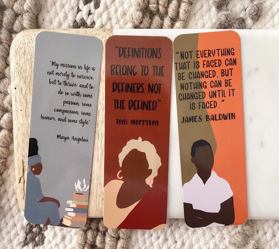 Three bookmarks. One features an illustration of James Baldwin with a quote, one an illustration with Toni Morrison and quote, and one with Maya Angelou and quote. 