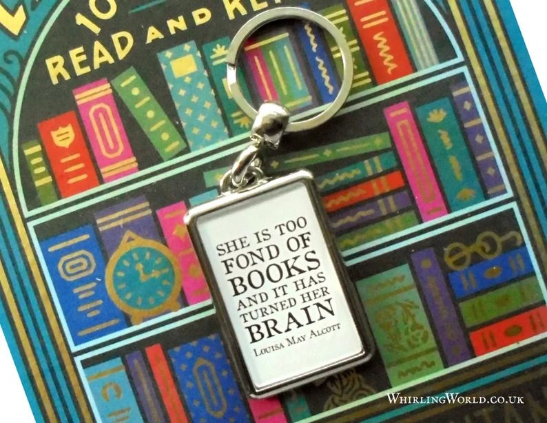 Photo of a rectangular metal keychain with the quote She is too fond of books and it has turned her brain, by louisa May Alcott