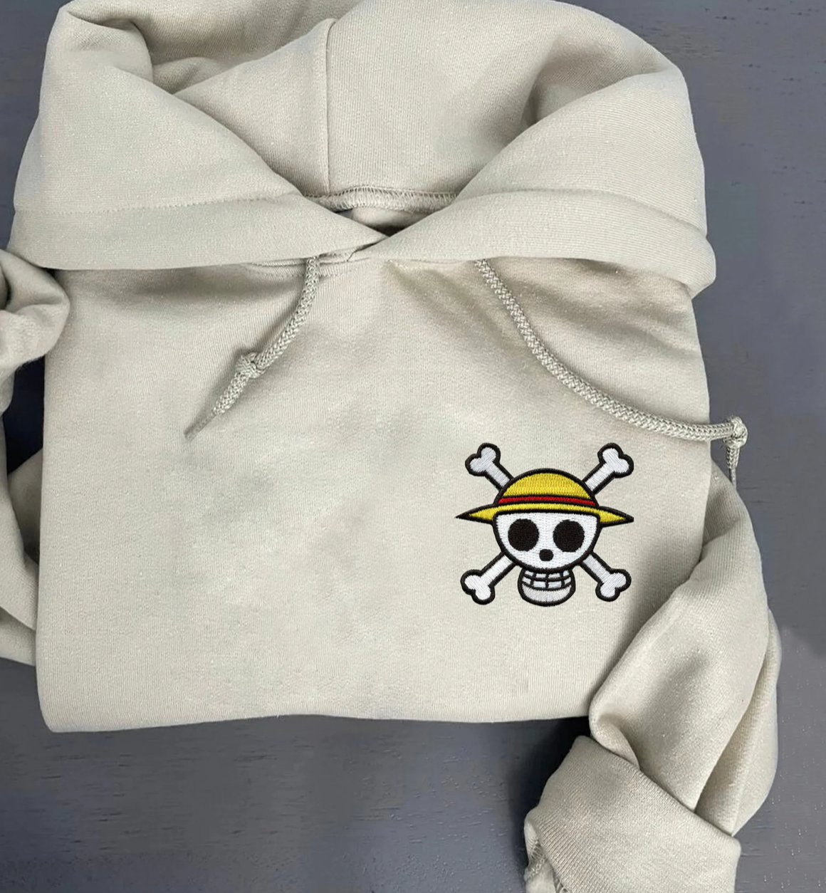 one piece hoodie with skull and crossbones