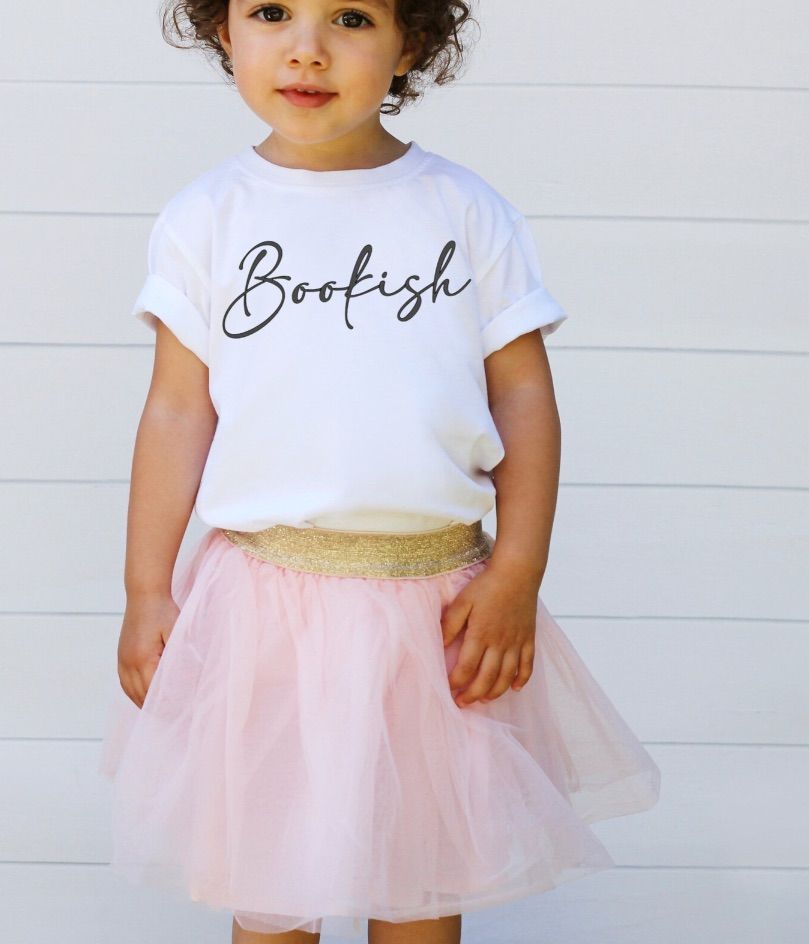 Image of a girl wearing a pink tutu and a white t-shirt that says "bookish."