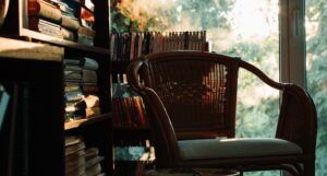 chair next to a small bookshelf