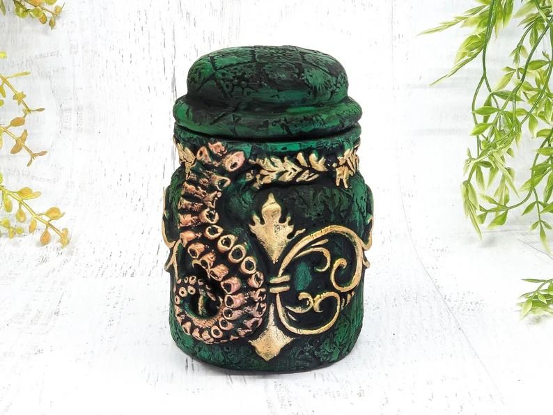 a photo of an apothecary jar with tentacles on the outside