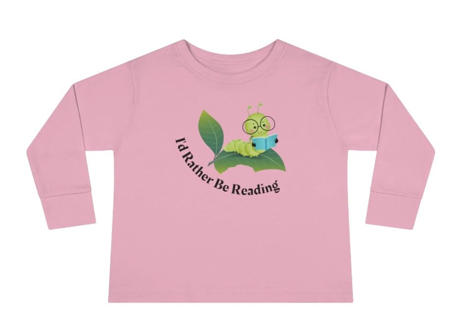Long sleeve pink shirt. It has a green worm with a book and the text "i'd rather be reading."