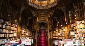 a photo of a bookstore with an elaborate staircase