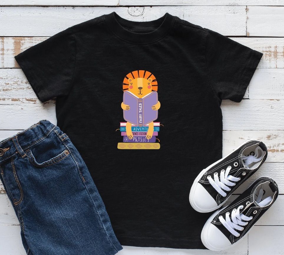 Image of a black t-shirt with aa lion reading a book in the middle. 