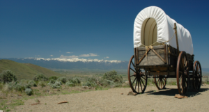 a photo of a covered wagon on a trail