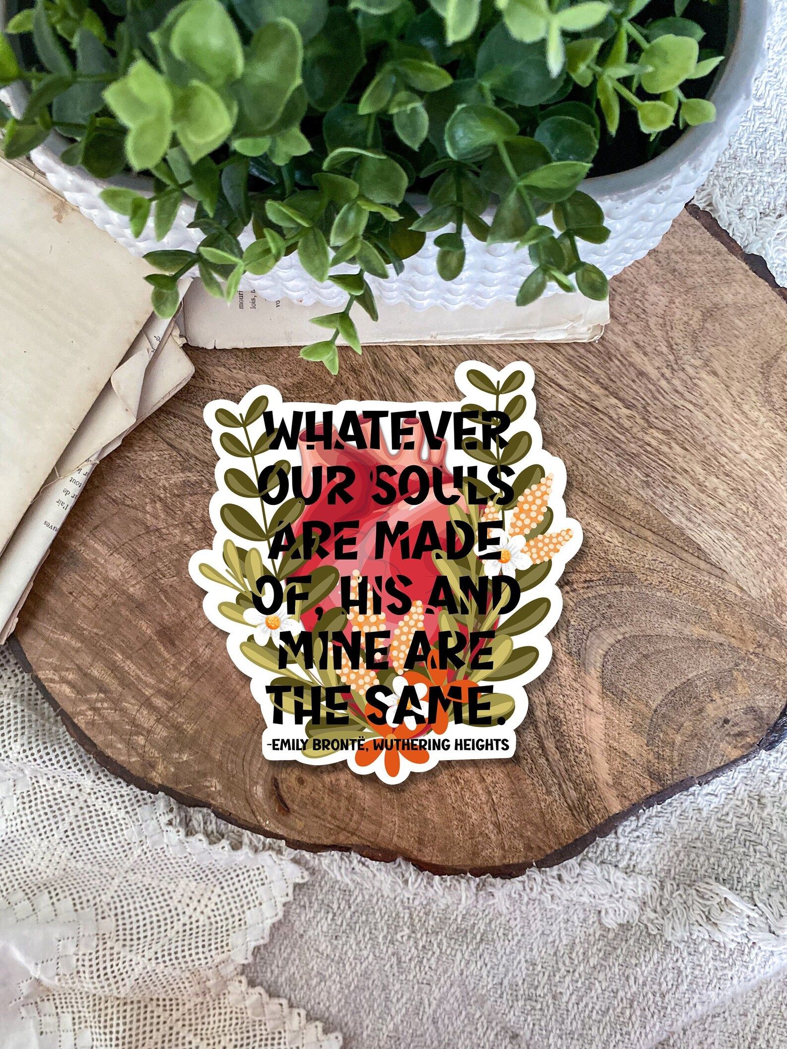 floral sticker with a quote from Emily Bronte's Wuthering Heights reading 