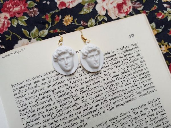 Earrings from Etsy featuring the head of Michelangelo's David. 